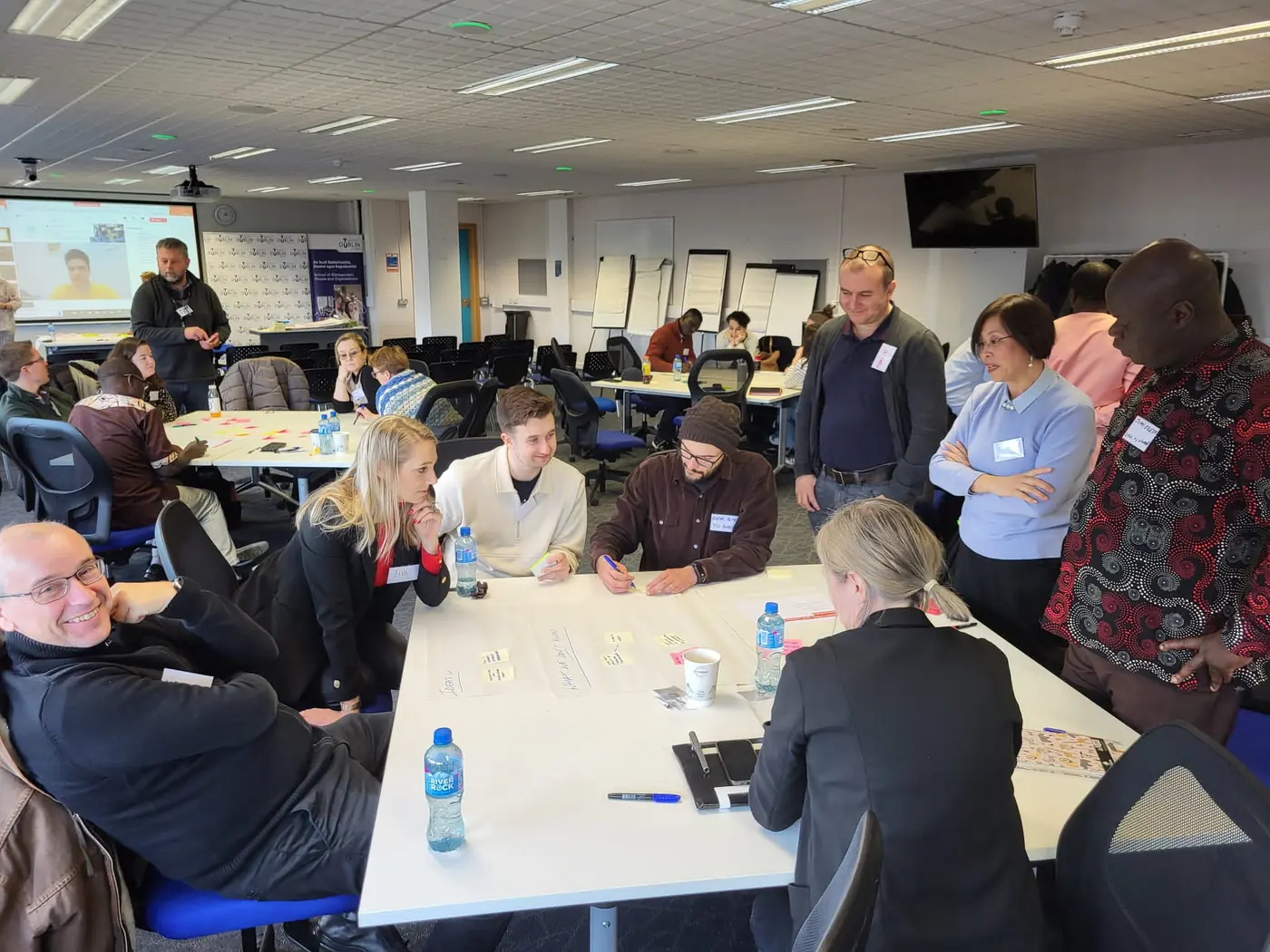 Researchers using sticky notes in an ideation session.